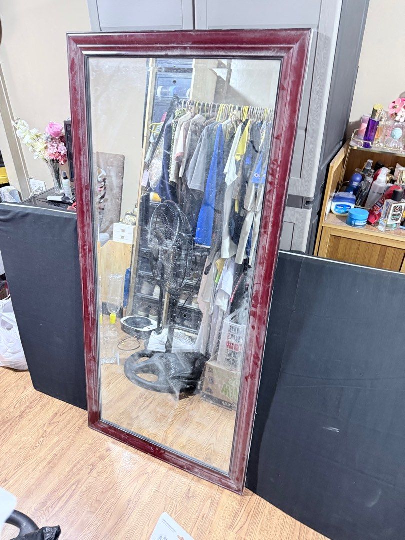 Large Maroon Framed Wall Beveled Mirror (Category: Mirrors) located in Manila. Submitted by jaychiiiii (Listing ID 1410672909, Image 1). Description: - Large rectangular mirror - Maroon frame - Dimensions: 59 inches (height) x 30 inches (width) - Minor imperfections on the frame (marks, small chip) - Ideal for bedroom or living room.