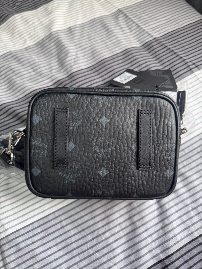 MCM unisex cross body bag (Category: Cross-body Bags) located in Malabon City. Submitted by ncdavadilla (Listing ID 1349999863, Image 3). Description: Bought from Duty Free. With dustbag. Brand new no issue.