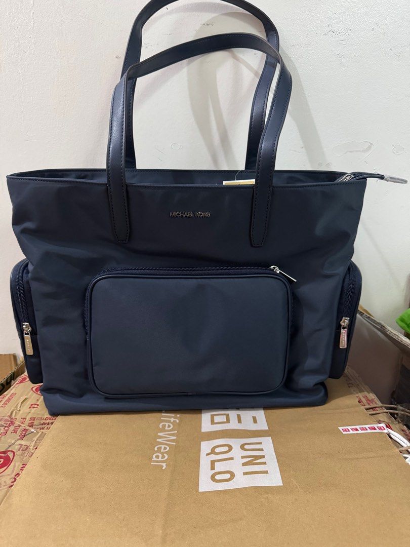 Michael Kors Cara Large Nylon Tote Bag (Category: Luxury Bags & Wallets) located in Quezon City. Submitted by branded_jo (Listing ID 1410571603, Image 1). Description: Original Michael Kors Cara Nylon Large Tote Navy blue Brand new with tag Bought in US Lalamove Ready.
