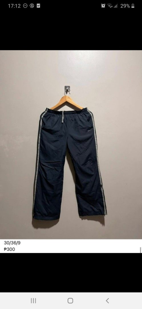 Navy Blue Track Pants with White Stripes (Category: Activewear) located in Manila. Submitted by reithrift (Listing ID 1410636662, Image 1). Description: - Navy blue track pants - White stripes down the sides - Drawstring waist - Lightweight material - Size: 30/36/9 - Price: ₱300.