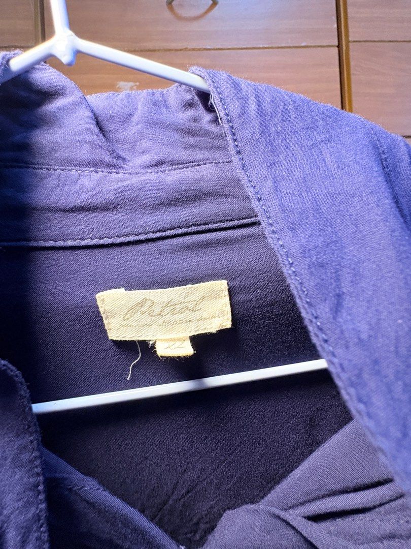 Petrol Long Sleeve Shirt (Category: Dresses) located in Makati City. Submitted by itsnaoczar (Listing ID 1410584062, Image 2). Description: - Petrol long-sleeved shirt - Classic button-down design - Features two chest pockets - Relaxed fit - Solid navy blue color - Size tag visible in image.