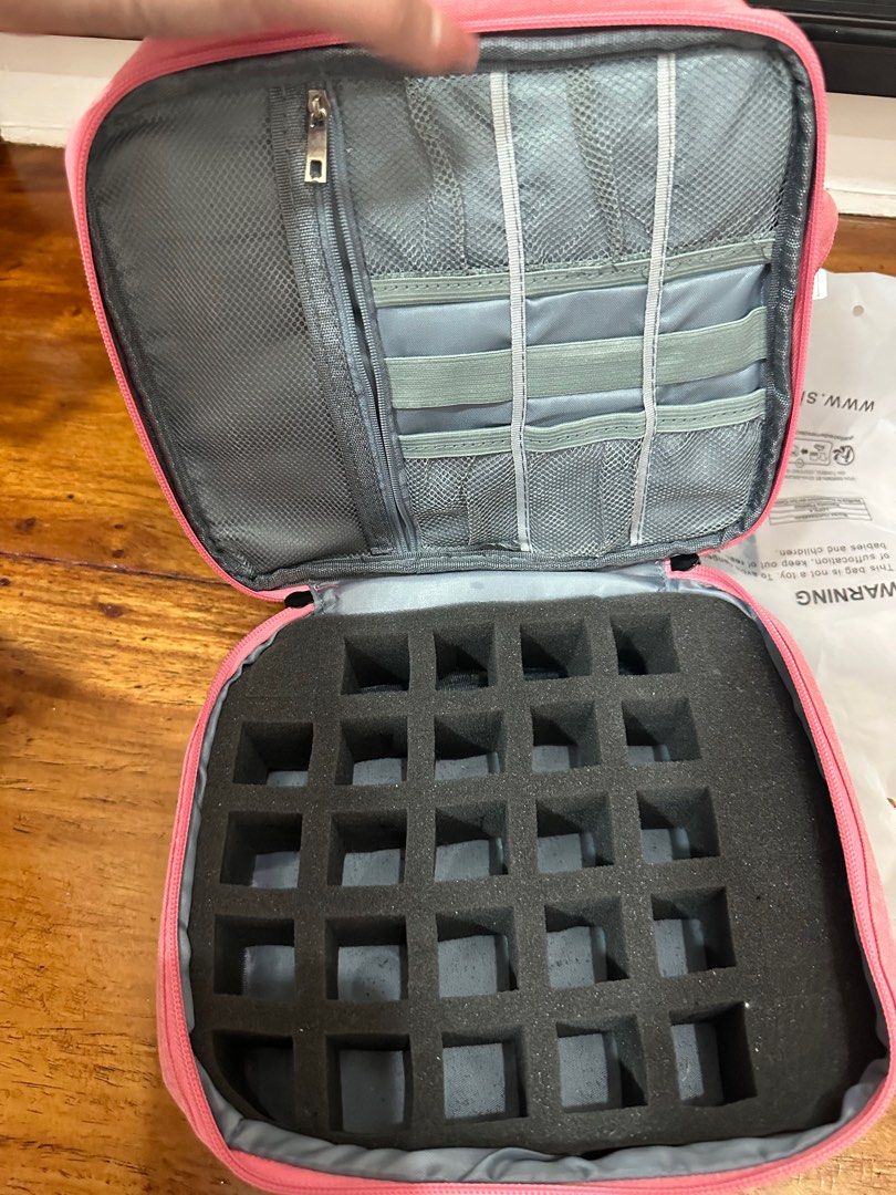 Pink nail accessories Organizer with Compartments (Category: Makeup) located in Quezon City. Submitted by mthereser43807 (Listing ID 1410708109, Image 3). Description: - Pink cosmetic organizer - Multiple compartments - Zippered closure - Top section with pockets - Bottom section with foam inserts - Zippered pocket inside lid - Grey interior lining - Ideal for nail accesories.