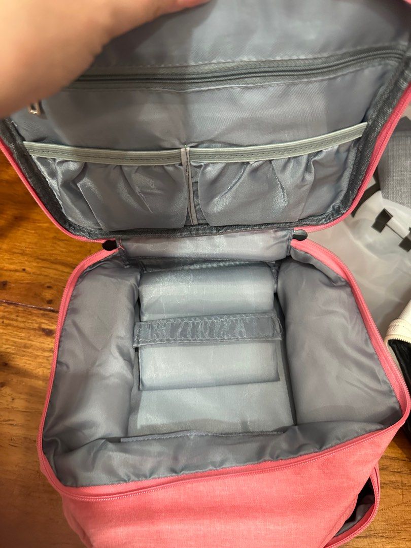 Pink nail accessories Organizer with Compartments (Category: Makeup) located in Quezon City. Submitted by mthereser43807 (Listing ID 1410708109, Image 2). Description: - Pink cosmetic organizer - Multiple compartments - Zippered closure - Top section with pockets - Bottom section with foam inserts - Zippered pocket inside lid - Grey interior lining - Ideal for nail accesories.