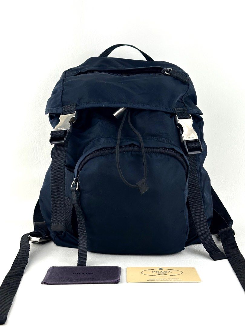 PRADA Re-Nylon Backpack (Category: Luxury Bags & Wallets) located in Manila. Submitted by luvluxe.mnl (Listing ID 1410656894, Image 1). Description: Small size but can fit a lot- fits laptop Comes with authenticity card Excellent to like new condition Unisex.