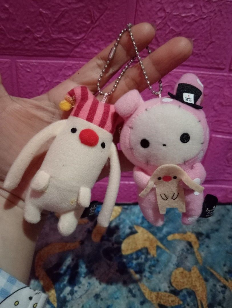 Sentimental Circus Plush Keychains set (Category: Plushies & Soft Toys) located in Bulacan. Submitted by renasophiatoystore2020 (Listing ID 1410656039, Image 1). Description: - Sentimental Circus plush keychains - Features Shappo and a pink bunny character - Pink bunny wearing a top hat - Includes metal chain for easy attachment - Official tags: "Sentimental Circus ©2012 San-X".