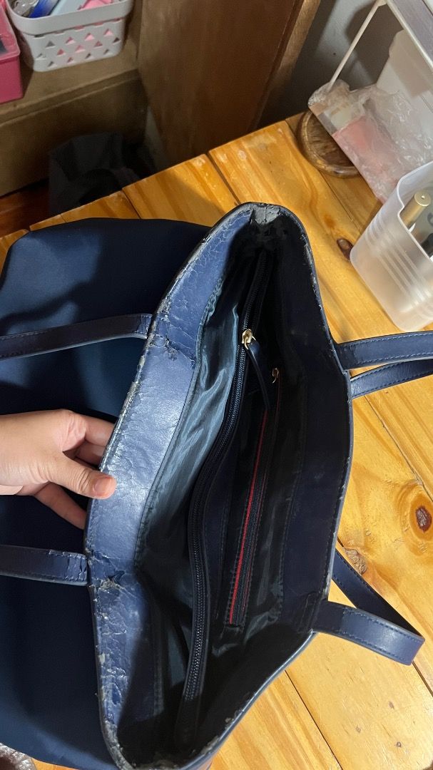 Tommy Nylon Bag (Category: Tote Bags) located in Lipa City. Submitted by declutterstuff123 (Listing ID 1410712330, Image 2). Description: Nylon is still in very good condition. Barely Used Parts with synthetic leather has cracked since nakatambak ng matagal sa cabinet. ⭕️Everything Must Go! ⭕️Grouped items are for TAKE ALL. No individual selling. ⭕️All items sold as is basis. Manage expectations based on pictures. No return, no exchange. ⭕️SF wil
