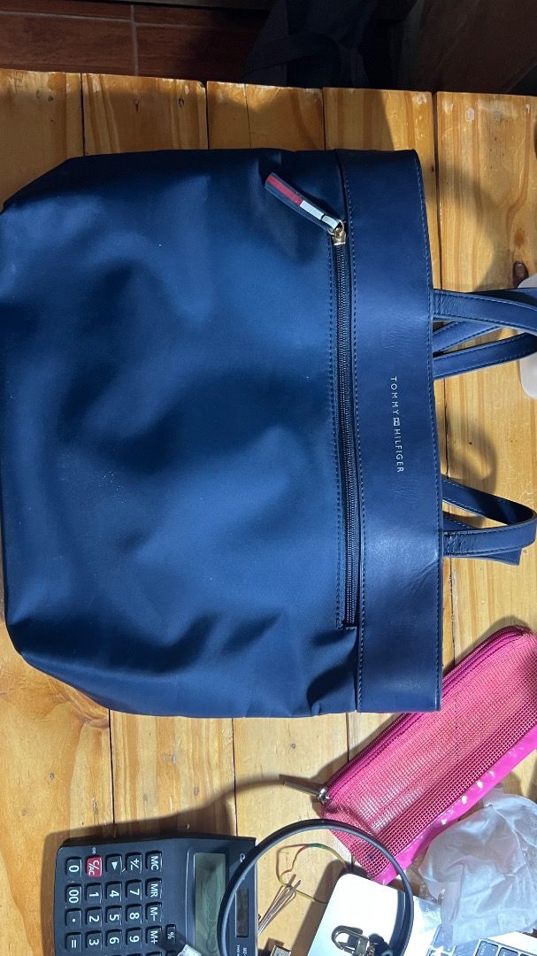 Tommy Nylon Bag (Category: Tote Bags) located in Lipa City. Submitted by declutterstuff123 (Listing ID 1410712330, Image 1). Description: Nylon is still in very good condition. Barely Used Parts with synthetic leather has cracked since nakatambak ng matagal sa cabinet. ⭕️Everything Must Go! ⭕️Grouped items are for TAKE ALL. No individual selling. ⭕️All items sold as is basis. Manage expectations based on pictures. No return, no exchange. ⭕️SF wil