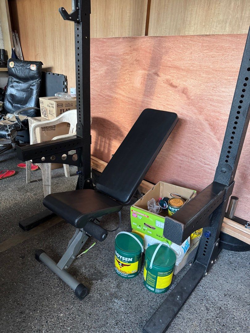 Weightlifting Rack with Bench (Category: Cardio & Fitness Machines) located in Manila. Submitted by choppee (Listing ID 1410696776, Image 3). Description: - Weightlifting rack with adjustable bench - Includes pull-up bar and J-hooks - Rack is black steel - Bench has black seat and backrest - Rack has multiple J-hook adjustment levels.