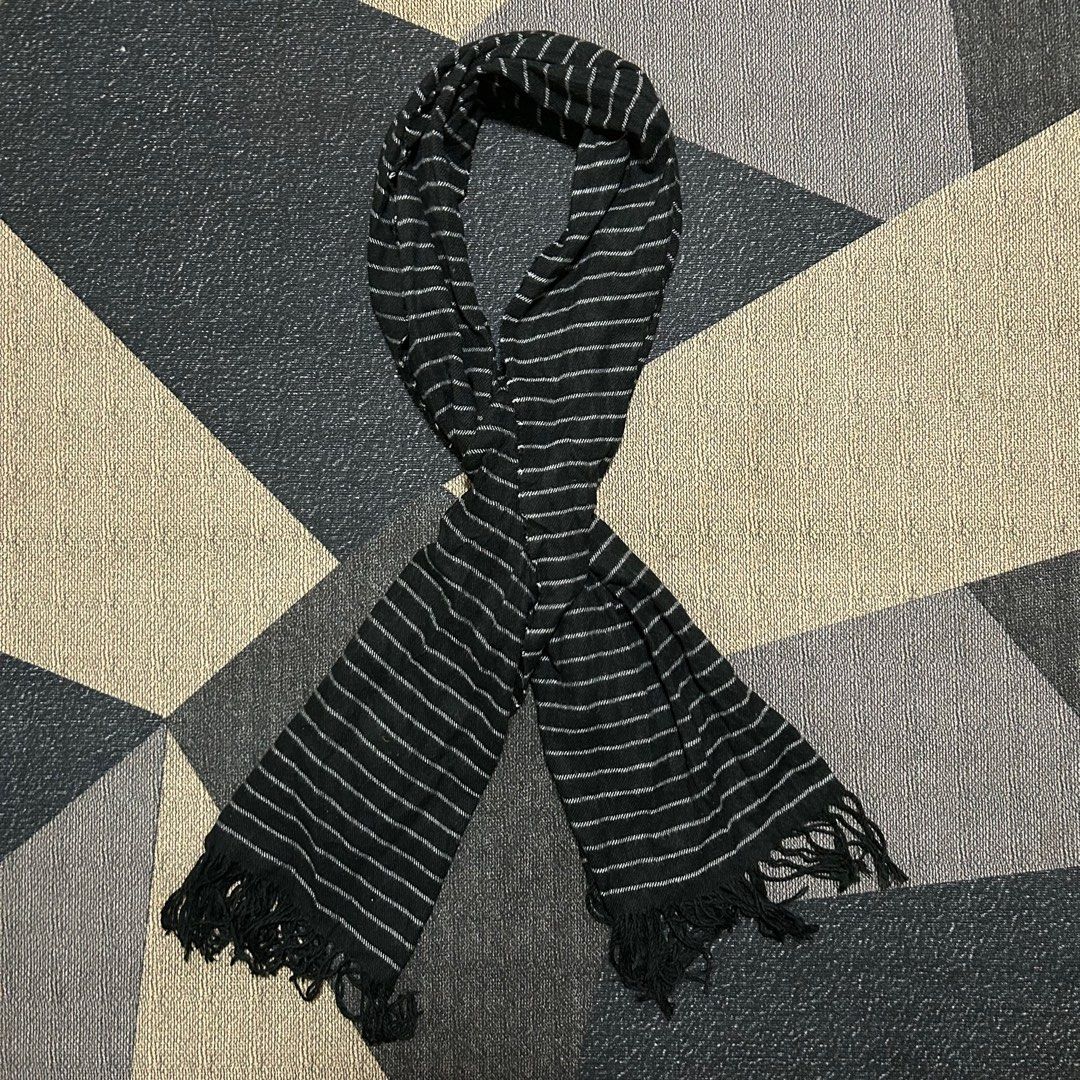 White Pinstripe Fringed Scarf (Category: Scarves) located in Cabuyao City. Submitted by joaquinb18 (Listing ID 1410707530, Image 2). Description: White Pinstripe Fringed Scarf Pattern: It features horizontal pinstripes (very thin white lines) against a solid black background. This is often referred to as a “ticking stripe” or “fine stripe” pattern. Texture: The weave appears to be a lightweight woven cotton or wool blend, giving it a soft but str