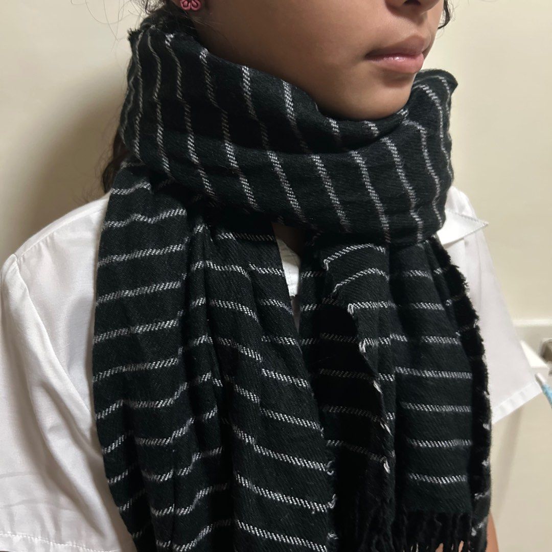 White Pinstripe Fringed Scarf (Category: Scarves) located in Cabuyao City. Submitted by joaquinb18 (Listing ID 1410707530, Image 3). Description: White Pinstripe Fringed Scarf Pattern: It features horizontal pinstripes (very thin white lines) against a solid black background. This is often referred to as a “ticking stripe” or “fine stripe” pattern. Texture: The weave appears to be a lightweight woven cotton or wool blend, giving it a soft but str