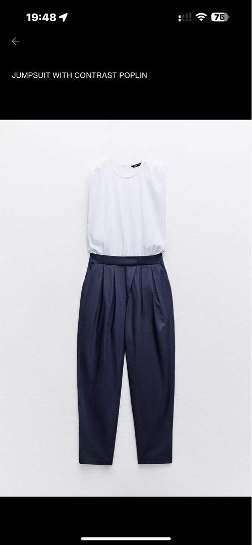 Zara Jumpsuit with Contrast Poplin (Category: Jumpsuits) located in Manila. Submitted by belletsy (Listing ID 1410657728, Image 3). Description: - Zara jumpsuit - White poplin top with round neckline and shoulder details - Dark navy pleated wide-leg bottom - Chic and modern style.