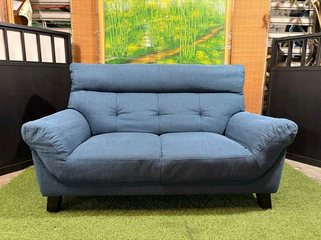 Blue Fabric 2-Seater Sofa (Category: Sofas) located in Valenzuela. Submitted by princeraya55649 (Listing ID 1407471834, Image 2). Description: High-Back Bulky 2 to 3-Seater Sofa SUPER SOFT & COMFY!!! Colorway : Blue (see VIDEO) Price : 12500 *VIDEO ON COMMENT 58L x 32W x 16H seat height inches Sandalan height 35 inches In VERY good condition Code HOMEBOSS 819.