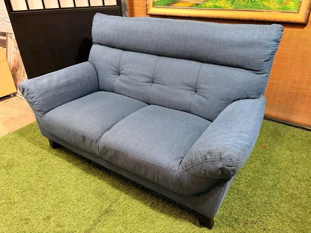 Blue Fabric 2-Seater Sofa (Category: Sofas) located in Valenzuela. Submitted by princeraya55649 (Listing ID 1407471834, Image 3). Description: High-Back Bulky 2 to 3-Seater Sofa SUPER SOFT & COMFY!!! Colorway : Blue (see VIDEO) Price : 12500 *VIDEO ON COMMENT 58L x 32W x 16H seat height inches Sandalan height 35 inches In VERY good condition Code HOMEBOSS 819.
