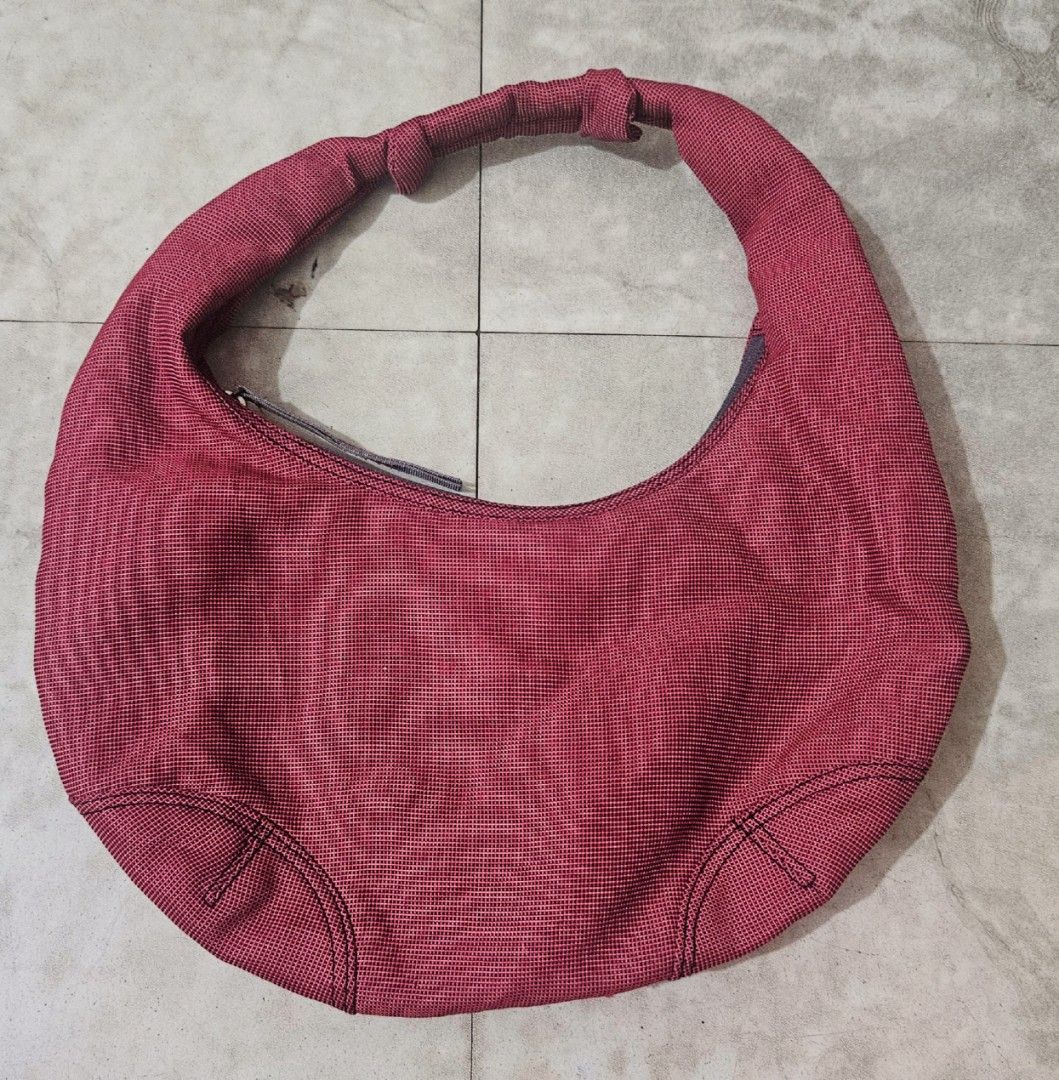 Champion Shoulder Bag (Hobo Bag) (Category: Shoulder Bags) located in Manila. Submitted by mpmpm13 (Listing ID 1407492698, Image 2). Description: Hi guys! I'm selling my Champion Hobo Bag in very good condition. - Red Champion shoulder bag - Like New Condition - Zipper working properly RFS: decluttering MOP: Gcash or Bank Transfer MOD: Grab or Lalamove c/o buyer - Interior lining visible.