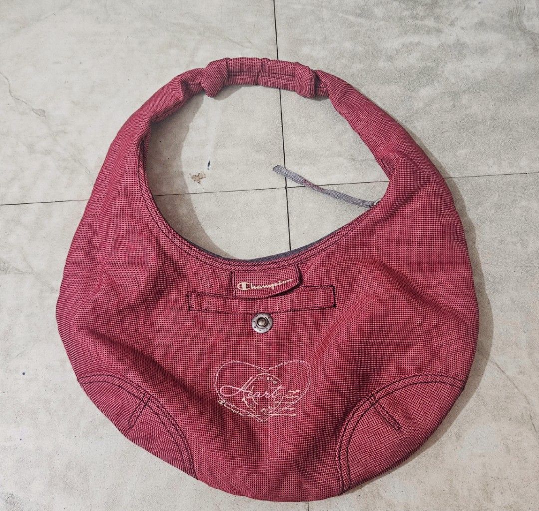 Champion Shoulder Bag (Hobo Bag) (Category: Shoulder Bags) located in Manila. Submitted by mpmpm13 (Listing ID 1407492698, Image 1). Description: Hi guys! I'm selling my Champion Hobo Bag in very good condition. - Red Champion shoulder bag - Like New Condition - Zipper working properly RFS: decluttering MOP: Gcash or Bank Transfer MOD: Grab or Lalamove c/o buyer - Interior lining visible.