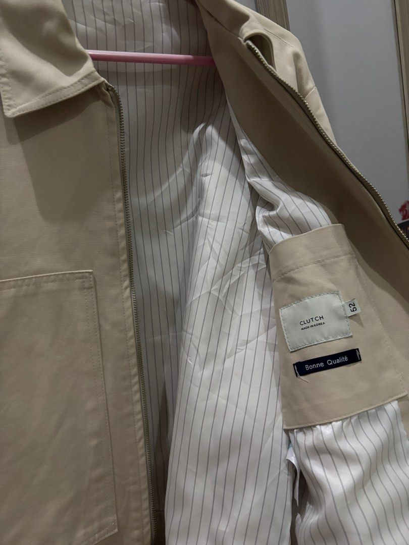 Clutch Jacket (Made in Korea) (Category: Coats, Jackets and Outerwear) located in Rizal. Submitted by bitethehand (Listing ID 1407532851, Image 2). Description: Cream / Beige colored jacket from Clutch Zip-up closure Two front pockets Buttoned cuffs Striped satin interior lining Size 52, 22x24 Only used once, with removable stain on right elbow part. (see last pic) .