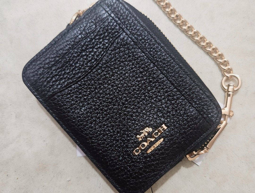 Coach Zip Card Case Wallet (Category: Luxury Bags & Wallets) located in Manila. Submitted by mpmpm13 (Listing ID 1407490820, Image 1). Description: Hi guys! I'm selling my Coach Zip Card Case Wallet in very good condition. - Authentic Coach - Chain strap has no flaws - Original tags included - Comparable value: $150.00 CAD RFS: decluttering MOP: Gcash or Bank Transfer MOD: Grab or Lalamove c/o buyer.