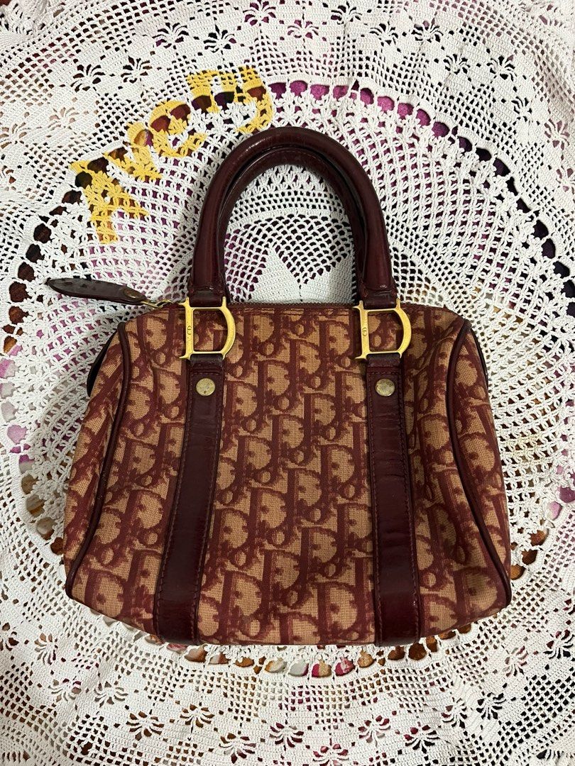 Dior rare vintage Boston Bag (Category: Luxury Bags & Wallets) located in Manila. Submitted by averyyyr (Listing ID 1407552021, Image 1). Description: Rfs: Rush need emergency funds For sure buyer only‼️willing kunin agad - Authentic Dior Boston bag - Iconic Dior monogram print - Burgundy and tan colorway - Dual top handles - Zip closure - Gold-tone hardware - Leather accents - Classic and stylish.