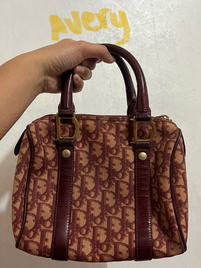 Dior rare vintage Boston Bag (Category: Luxury Bags & Wallets) located in Manila. Submitted by averyyyr (Listing ID 1407552021, Image 2). Description: Rfs: Rush need emergency funds For sure buyer only‼️willing kunin agad - Authentic Dior Boston bag - Iconic Dior monogram print - Burgundy and tan colorway - Dual top handles - Zip closure - Gold-tone hardware - Leather accents - Classic and stylish.