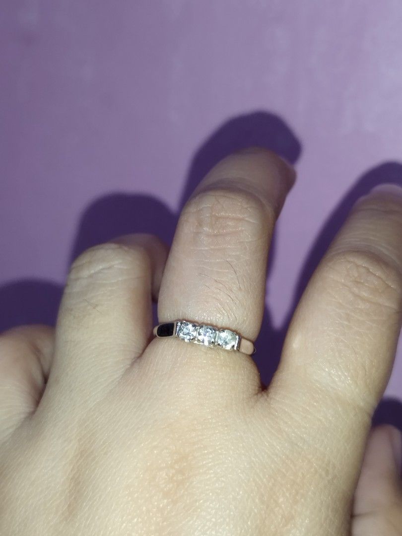 Fashion Ring with Three Stones (Category: Rings) located in Manila. Submitted by Cie28 (Listing ID 1407550363, Image 1). Description: - Silver tone ring with three clear stones - Size 6 - Stones set in a row - Suitable for everyday wear or special occasions -magnetic .