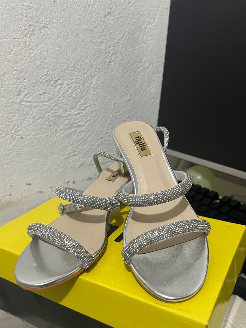 Heels - Silver Figlia (Category: Flats & Sandals) located in Marikina City. Submitted by mgdeclutteringph (Listing ID 1407464406, Image 1). Description: - Figlia silver heels - Double strap design with rhinestones - Low heel - Comfortable footbed - Ideal for special occasions - Comes with original box Used once loc: Marikina.