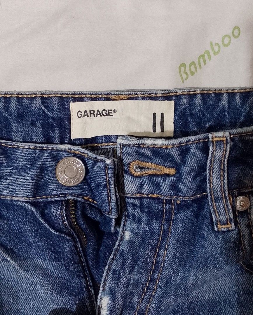 Garage Denim Shorts - Size 11 (Category: Shorts) located in Pasig City. Submitted by lizasxnw (Listing ID 1407431222, Image 3). Description: - Garage distressed denim shorts - Size 11 - Classic five-pocket design - Button and zipper closure - Raw hem - Ripped details on front and back - Ideal for casual wear.