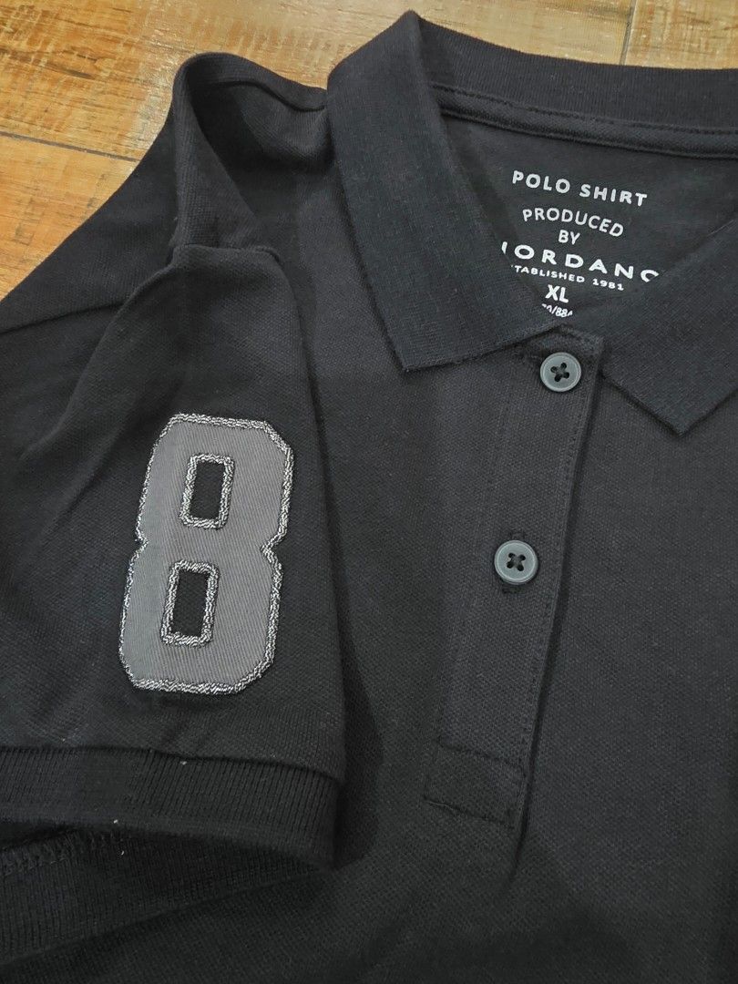 Giordano Polo Shirt XL (Category: Blouses) located in Quezon City. Submitted by bagsplusmore (Listing ID 1407529186, Image 3). Description: - Giordano black polo shirt - Size: XL - New with tags - Features horse logo on chest - Number "8" on left sleeve - Three-button placket - Collar.