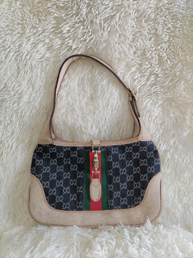 Gucci Denim Shoulder Bag (Category: Luxury Bags & Wallets) located in Davao. Submitted by cosmicforest_950ad8 (Listing ID 1407471561, Image 1). Description: - Gucci shoulder bag - Denim exterior with GG pattern - Beige leather trim - Red and green stripe detail - Red fabric interior lining - Includes a zipper pocket - Made in Italy - Serial number included -Issue: Gamuza na ang leather part 850 SHIPPED No cancellations Manage ur expectations sinc