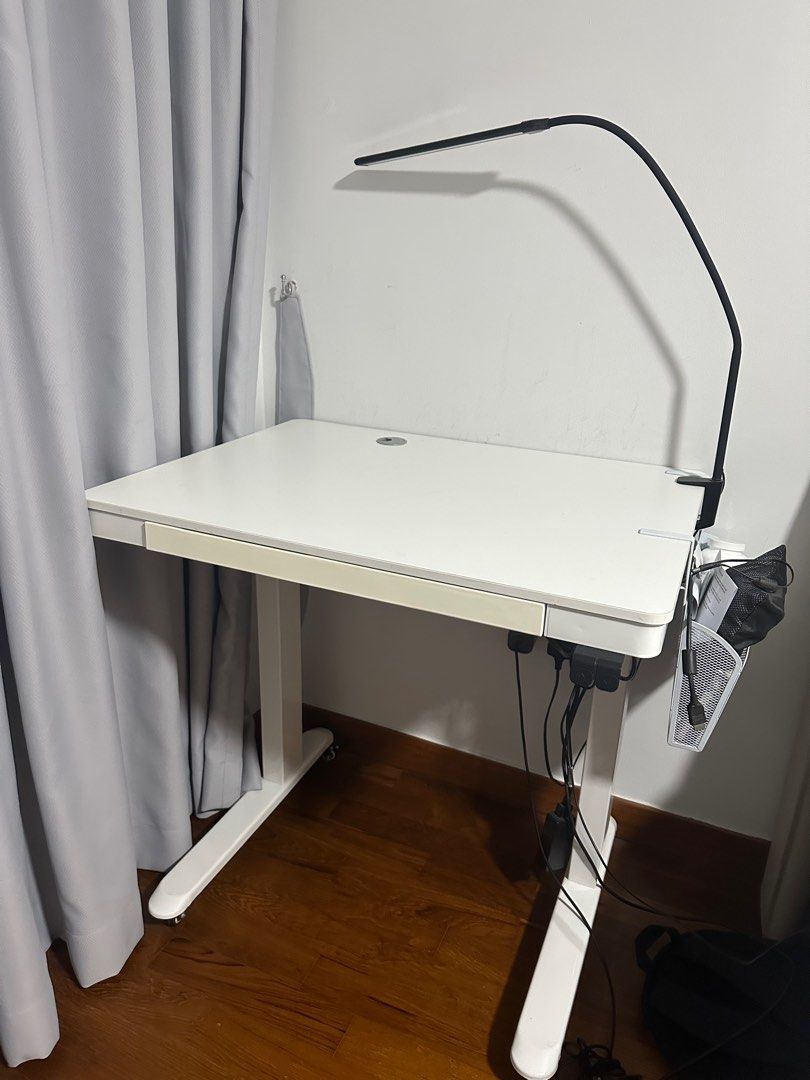 Height adjustable study/ work table (Category: Tables & Sets) located in Singapore. Submitted by liveearth-698f (Listing ID 1407496577, Image 1). Description: - Height adjustable table perfect for work/ studying - 80cm x 60cm - adjustable at the push of a button - price negotiable.