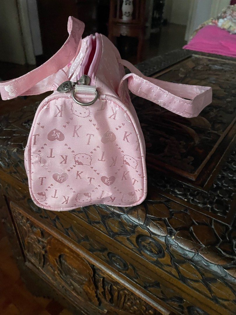 Hello Kitty Pink Handbag (Category: Shoulder Bags) located in Quezon City. Submitted by deadmit (Listing ID 1407563943, Image 2). Description: Just has a ballpen mark as shown in pic… No other issues… like new.