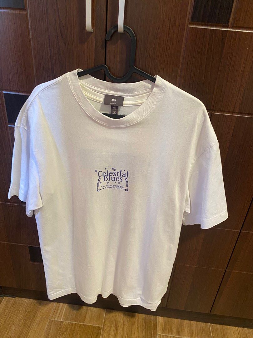 H&M Celestial Blues Loose Fit T-shirt (Category: Tshirts & Polo Shirts ) located in Manila. Submitted by copiccoo (Listing ID 1407394004, Image 1). Description: - H&M T-shirt - Features a "Celestial Blues" graphic (front and back) - Size: US S, EUR S, CAP S, MX CH - Loose fit, crew neck - Made of soft material - Slightly Used Condition.