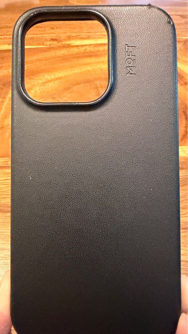 Iphone 14 Pro - MOFT leather case (Category: Cases & Sleeves) located in Makati City. Submitted by taffyjelly (Listing ID 1407390409, Image 2). Description: Moft leather case in navy blue gor iphone 14 pro. Has small scratch upper right. RFS: decluttering SF c/o buyer.