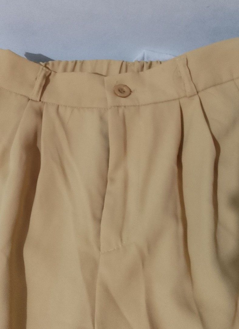 Khaki Wide Leg Trouser Pants - 30 (Category: Other Bottoms) located in Pasig City. Submitted by lizasxnw (Listing ID 1407432772, Image 3). Description: - Khaki wide-leg pants - Button closure - Front pleats - Relaxed fit - Lightweight fabric - Versatile style.