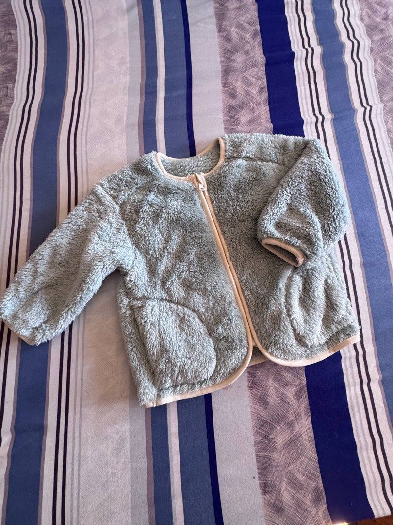 Kids GU Fleece Jacket - Size 100 (Category: Babies & Kids Fashion) located in Legazpi City. Submitted by mechan88 (Listing ID 1407382070, Image 1). Description: - GU light blue fleece jacket - Size 100 - Full zipper closure - Two front pockets - Round neckline - Long sleeves - Soft and fluffy fleece material - Light beige trim.
