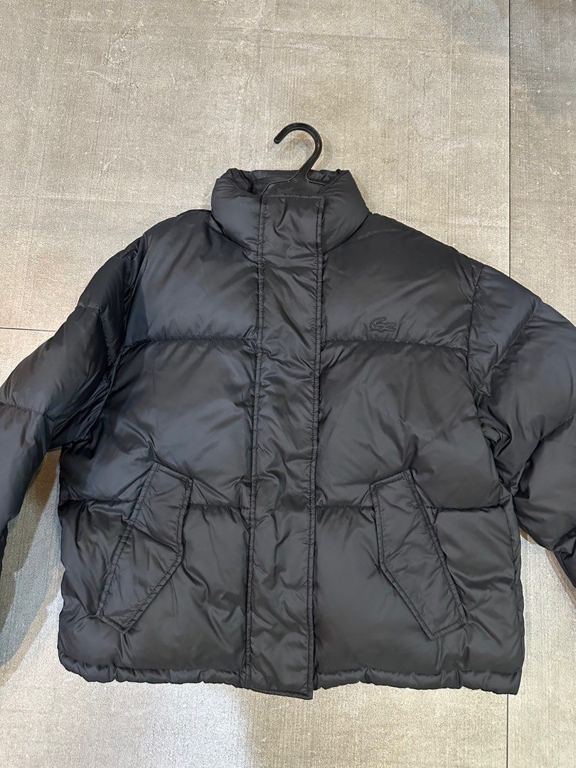 Lacoste Puffer Jacket (Category: Coats, Jackets and Outerwear) located in Manila. Submitted by mdeclutterrr (Listing ID 1407486193, Image 1). Description: Lacoste puffer jacket Cropped fit Black exterior - orange interior Not reversible Used 3x for winter trip Bought in Japan.
