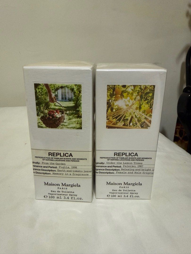 Maison Margiela Replica E'au de Toilette 100ml (Category: Fragrance & Deodorants) located in Pateros City. Submitted by _goldenbb (Listing ID 1407511337, Image 1). Description: - Maison Margiela Replica Eau de Toilette - Available scents: 'Under the Lemon Trees' and 'From The Garden' - Size: 100ml each - Condition: New and sealed - Price per box: P8500 Bundle for both : PHP 16,000 .