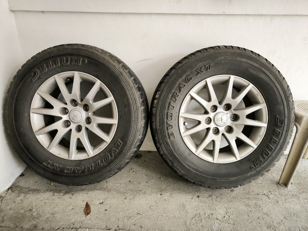 Montero Stock Rims (set -4pcs) (Category: Mags and Tires) located in Manila. Submitted by martinolx218 (Listing ID 1407395289, Image 1). Description: For sale 2010 Montero Stock Rims size 17 6holes pcd 139 with signs of use, some guttermarks but still presentable set of 4 intact pa yung orig MMC TPMS sa pito (pero not working na sa katagalan) with freebie tires pangtayo (3pcs only) 265 70 17 Delium Evoteac XT (as seen sa pic) mfg 2023 (see pic) 2
