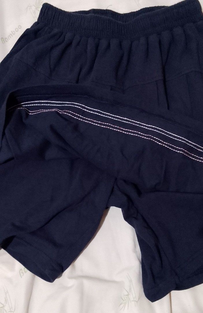 Navy Blue Skirt with Shorts (Category: Skirts) located in Pasig City. Submitted by lizasxnw (Listing ID 1407453116, Image 2). Description: - Navy blue skirt - Red and white striped hem - Elastic waistband - Includes navy blue shorts underneath - Made of soft fabric.