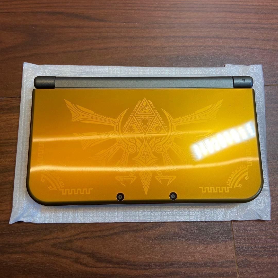 New Nintendo 3DS LL Hyrule Edition (Category: Nintendo) located in Manila. Submitted by japan_treasure (Listing ID 1407385264, Image 3). Description: Upon inspection, we found a small, barely noticeable scratch on the top of the unit and slight peeling on the left and right sides. Other than that, it is in very good condition. There are no noticeable scratches or signs of use. It is almost unused. Comes with box, instruction manual, charger and s