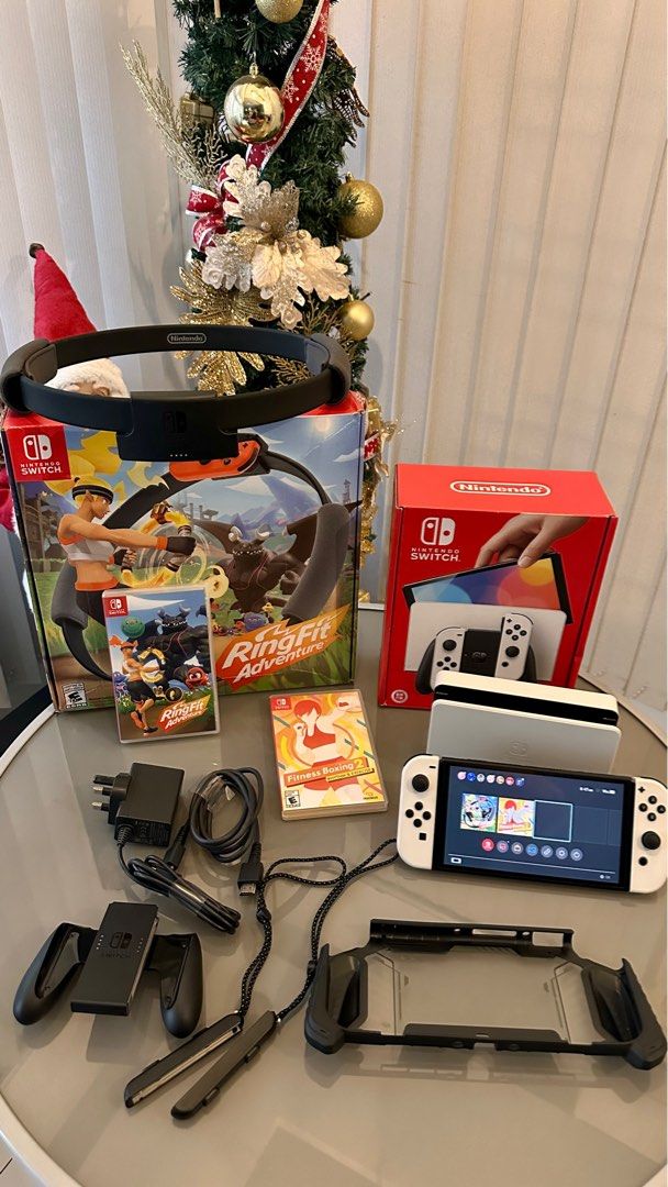 Nintendo Switch OLED (Category: Nintendo) located in Quezon City. Submitted by mythingsforless (Listing ID 1407512844, Image 1). Description: Selling my Nintendo Switch OLED (White) — looks brand new! Complete set and in excellent condition. So here’s the full bundle: -Switch OLED 64GB Complete set with box -RingFit set with box -Games: Ringfit Adventure & Fitness Boxing 2 -Dockable Rugged Protective case RFS: 1. Rarely used 2. Plano ko sana magi