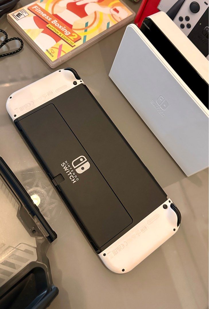 Nintendo Switch OLED (Category: Nintendo) located in Quezon City. Submitted by mythingsforless (Listing ID 1407512844, Image 3). Description: Selling my Nintendo Switch OLED (White) — looks brand new! Complete set and in excellent condition. So here’s the full bundle: -Switch OLED 64GB Complete set with box -RingFit set with box -Games: Ringfit Adventure & Fitness Boxing 2 -Dockable Rugged Protective case RFS: 1. Rarely used 2. Plano ko sana magi