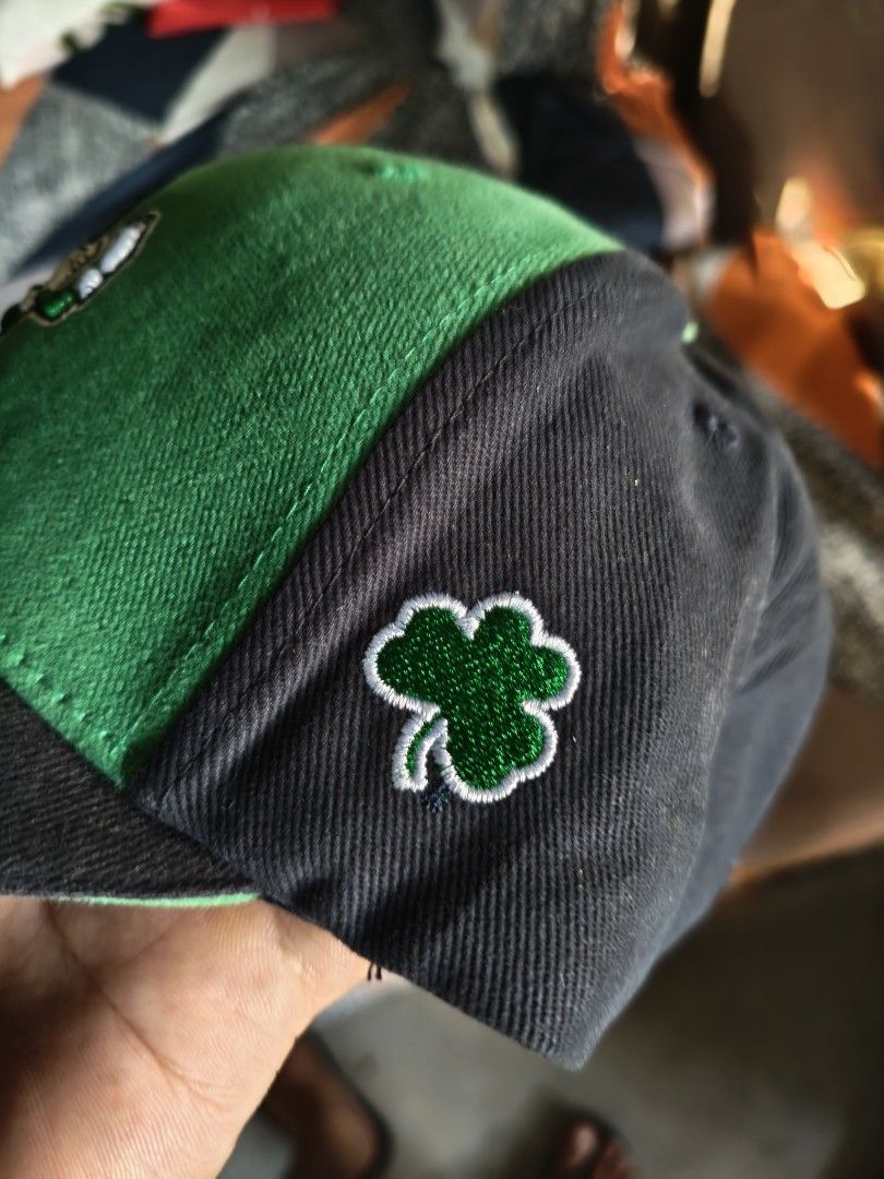 Notre Dame Irish Cap (Category: Caps & Hats) located in San Jose del Monte. Submitted by authenticeraph (Listing ID 1407448464, Image 3). Description: - Notre Dame Irish cap - Features the Notre Dame logo - Green and black color scheme - Shamrock detail on the side - Adjustable strap with "IRISH" text - "Captivating" tag inside.