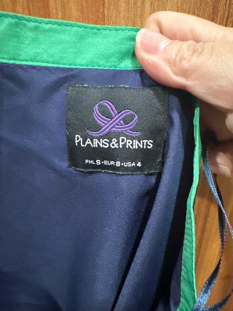 Plains & Prints Striped Skirt (Category: Skirts) located in Quezon City. Submitted by struddels (Listing ID 1407475017, Image 2). Description: - Plains & Prints skirt - Striking blue and green stripes - Unique design with green trim - Size: PHL S / EUR 8 / USA 4 - Silky fabric.
