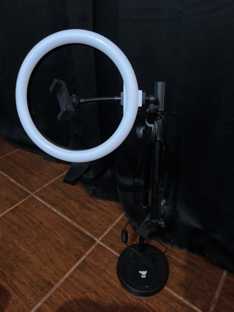 Ring Light with Phone Holder (Category: Lighting & Studio Equipment) located in Muntinlupa City. Submitted by jacknthrift (Listing ID 1407415610, Image 1). Description: - Perfect for video calls, streaming, and photos. - Circular ring light with phone holder. - Adjustable stand. - Stable round base. - In good working condition. Used once. RFS: Decluttering.
