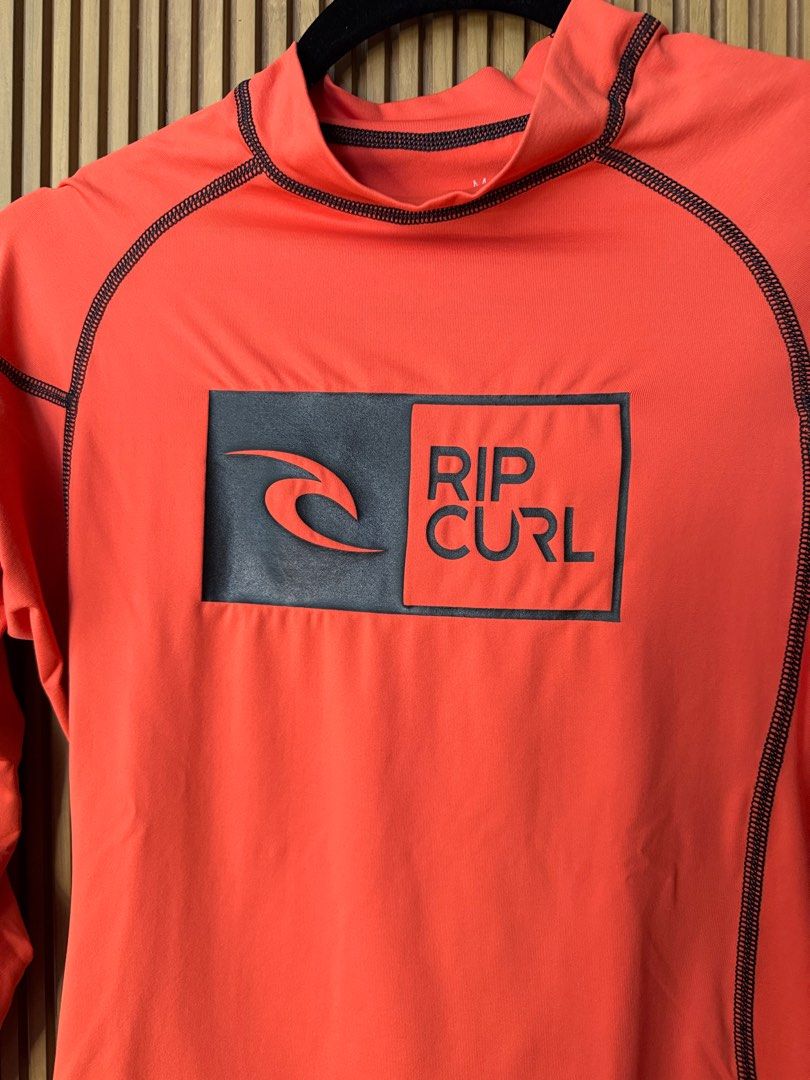 Ripcurl Orange Long Sleeves Rash Guard (Category: Activewear) located in Makati City. Submitted by kytriestosell (Listing ID 1407439615, Image 2). Description: - authentic ripcurl rash guard.