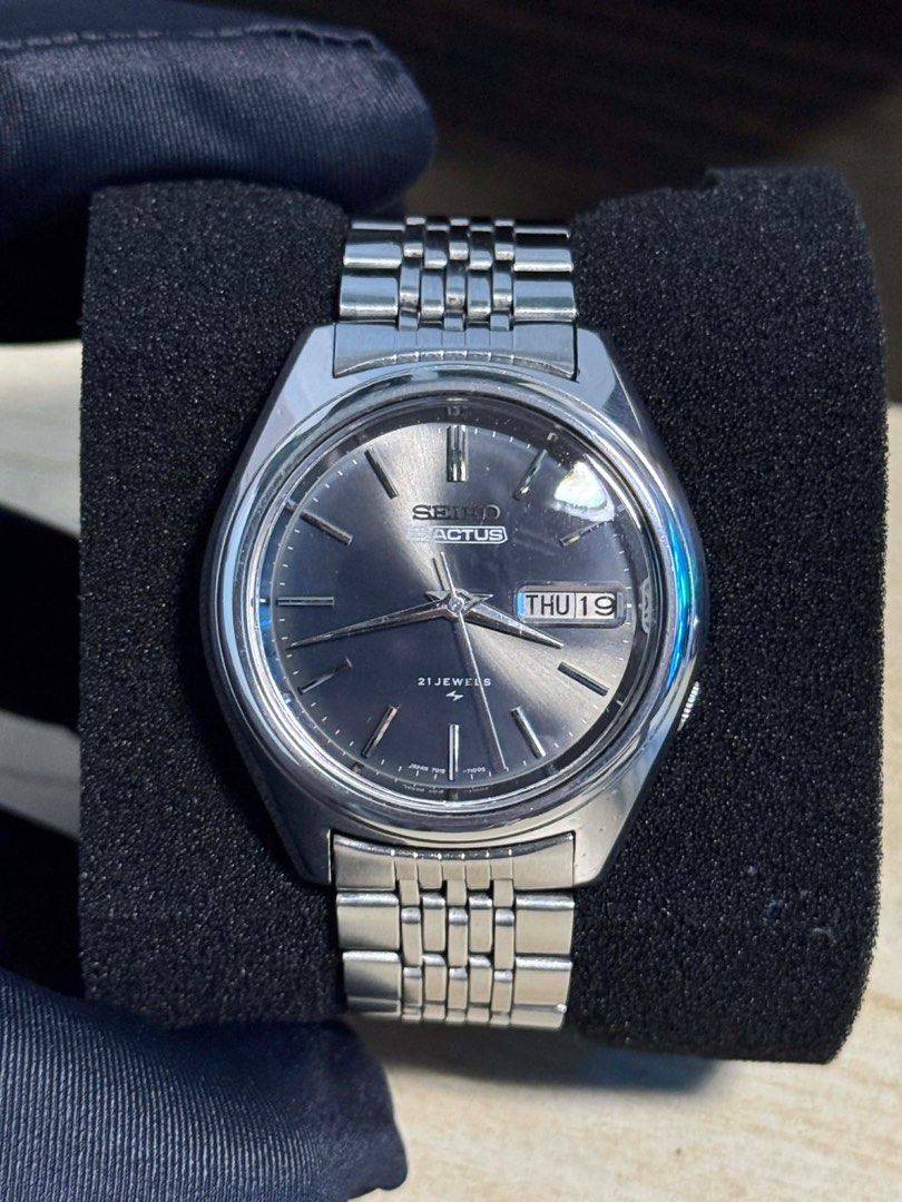 Seiko Actus (Category: Men's Watches) located in Caloocan City. Submitted by decluttervette (Listing ID 1407539509, Image 1). Description: Vintage Seiko 5 Actus 7019-7060 – Circa 1975 Model: Seiko 5 Actus 7019-7060 Year: Circa 1975 Movement: Automatic Seiko Cal. 7019 (21 jewels) Case: 36mm stainless steel Dial: Dark sunburst with applied indices Crystal: Acrylic Bracelet: Original Seiko stainless steel Features: Day-date complication (Kanji & Eng