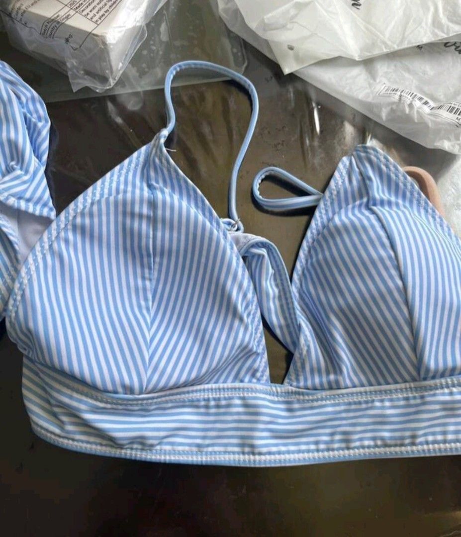 Shein Striped High Waist Bikini Set (Category: Bikinis & Swimsuits) located in Manila. Submitted by monaaa03 (Listing ID 1407558344, Image 2). Description: Light blue and white striped bikini set from Shein. Features a triangle top and high-waisted bottoms. The bottoms have a ruched detail on the sides. Perfect for the beach or pool..