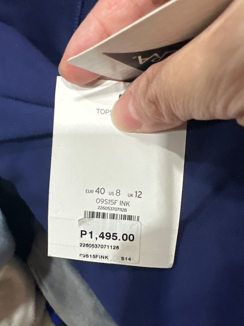 Topshop Blue Dress (Category: Dresses) located in Quezon City. Submitted by struddels (Listing ID 1407476448, Image 3). Description: Topshop dress is a beautiful shade of blue. It features a round neckline and short sleeves. The dress has a fitted bodice that flows into a flared skirt. The tag indicates the size is EUR 40, US 8, and UK 12. Made in Mauritius..