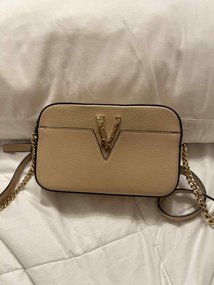 VERSACE V LOGO CROSSBODY BAG BEIGE (Category: Luxury Bags & Wallets) located in Arayat. Submitted by cjscolis (Listing ID 1407530037, Image 1). Description: BARELY USE SlIghtly negotiable .
