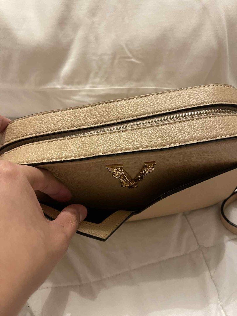 VERSACE V LOGO CROSSBODY BAG BEIGE (Category: Luxury Bags & Wallets) located in Arayat. Submitted by cjscolis (Listing ID 1407530037, Image 2). Description: BARELY USE SlIghtly negotiable .